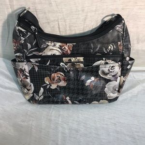 Rosetti floral faux leather purse.